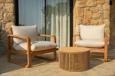 two chairs and a coffee table in a room at Bergerie entre plage et maquis in Zonza