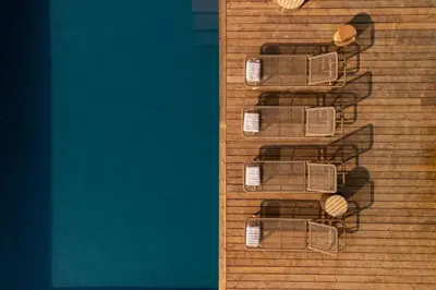 a group of chairs on a wooden wall at Bergerie entre plage et maquis in Zonza