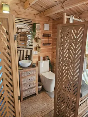 a bathroom with a toilet and a sink at Le cabanon de casaOma in Prunelli-di-Fiumorbo