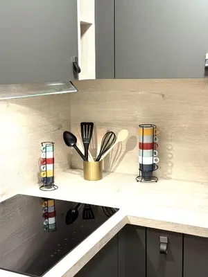 a kitchen counter with utensils on a counter top at Fiori di Cala Rossa Signature in Lecci