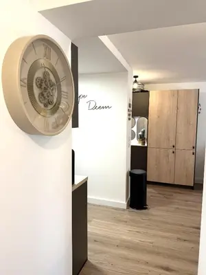 a clock on a wall in a room at Fiori di Cala Rossa Signature in Lecci