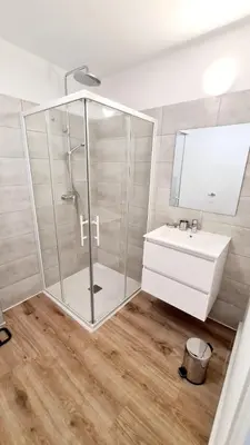 a bathroom with a glass shower and a sink at Fiori di Cala Rossa Signature in Lecci