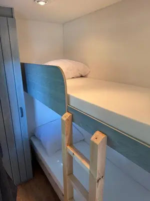 a small room with two bunk beds in it at I Dui Quarci in Prunelli-di-Fiumorbo