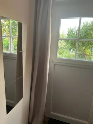 a bathroom with a mirror and a window at Casa Nustrali in Alata
