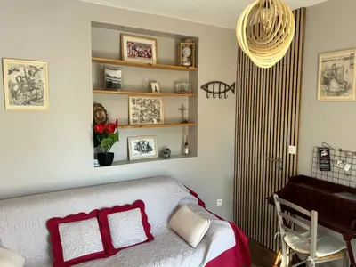 a bedroom with a bed and a piano at Casa Nustrali in Alata