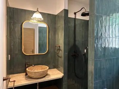 a bathroom with a sink and a shower at Casa di l'Ortu - Villa neuve avec piscine privée chauffée in Feliceto