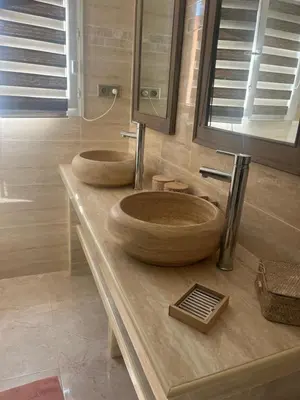 two wooden sinks sitting on a counter in a bathroom at Appartement Centre-Ville Propriano in Propriano