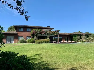 a house with a lawn in front of it at Villa Lavezzi in Bonifacio