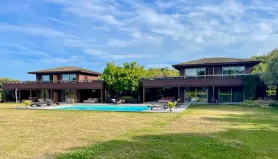 a house with a swimming pool in the yard at Apartments PETIT DOMAIN DE SPERONE in Bonifacio