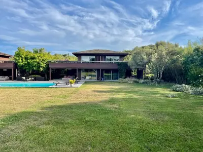 a house with a yard with a swimming pool at Apartments PETIT DOMAIN DE SPERONE in Bonifacio