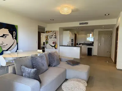 a living room with a couch and a table at T4 Cote Plage N6 face a la mer in Pinarellu