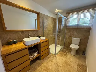 a bathroom with a sink and a shower and a toilet at Loue Villa Bonifacio vue mer in Bonifacio