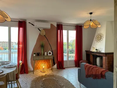 a living room with red curtains and a fireplace at Casa Lucia in Aléria