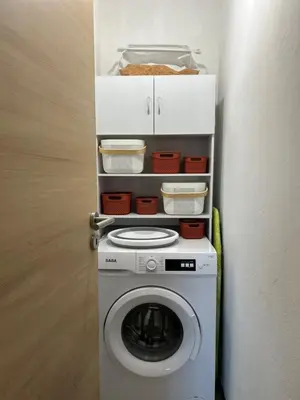 a washer and dryer in a corner of a room at Casa Lucia in Aléria