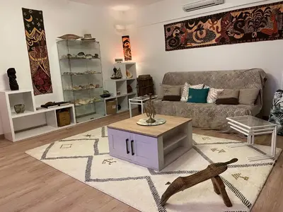 a living room with a couch and a table at Le Cosy Corse in Vico