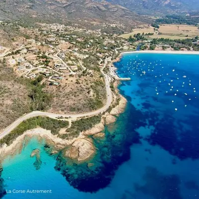 an aerial view of a small island in the ocean at Le Cosy Corse in Vico