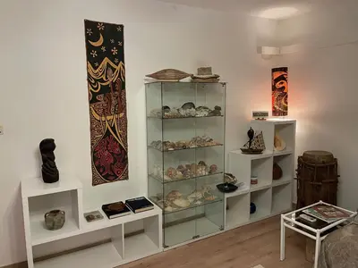 a display case filled with lots of different types of ceramics at Le Cosy Corse in Vico