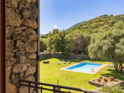 a view from a window of a yard with a swimming pool at Holiday Home Casa Gabrielle by Interhome in Lama