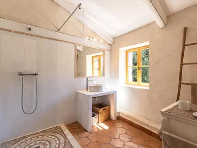 a bathroom with a shower and a sink and a mirror at Holiday Home Casa Gabrielle by Interhome in Lama