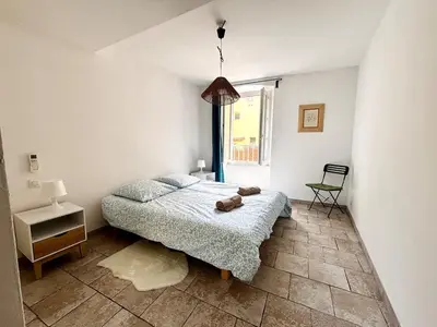 a bedroom with a bed with a teddy bear on it at Casamea - Vieille Ville, 2 min plage, Clim in Ajaccio