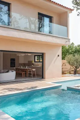a house with a swimming pool next to a house at Villa Luciana Di Santa Lucia in Sainte-Lucie de Porto-Vecchio