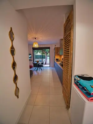 a hallway leading to the kitchen and dining room at havre de paix au bord de mer - Casa Marina in Borgo