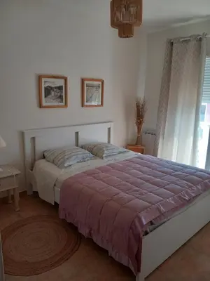 a bedroom with a bed and a window at Chez Rachel chambre et salle bain privative chez l'habitant in Aléria