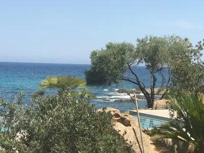 a view of the ocean from a beach at Haut standing- Face à la mer! 3 chambres-piscine semi olympique in Sari Solenzara
