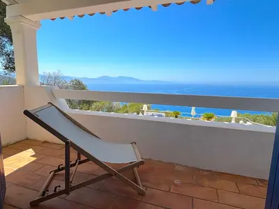a view of the ocean from the top of a hill at Villa Paomia in Cargèse
