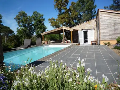 a swimming pool in the backyard of a house at La Bergerie - Les Sittelles in Pinarellu