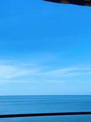 a view of the ocean from a train window at VUE MER EXCEPTIONNELLE !! Bien calme et lumineux sur la prestigieuse route des Sanguinaires à Ajaccio in Ajaccio