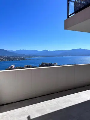 a view of a body of water from a building at Beautiful Appartment Les terrasses de Torretta room sea view Ajaccio in Ajaccio