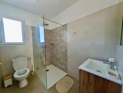 a bathroom with a toilet and a sink and a shower at Villa Antonia in SERRA DI FIUMORBO