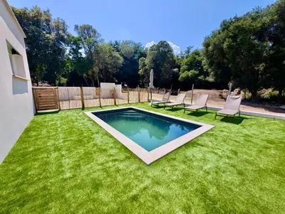 a backyard with a swimming pool in the grass at Villa Antonia in SERRA DI FIUMORBO