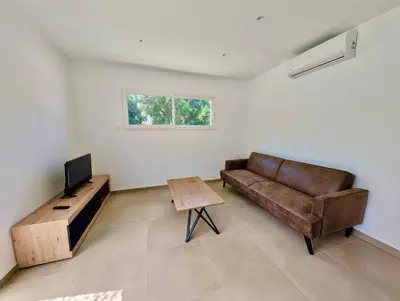 a living room with a couch and a table at Villa Antonia in SERRA DI FIUMORBO