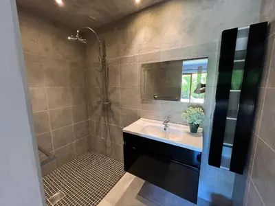 a bathroom with a sink and a shower at Costa di fiori in Coti-Chiavari