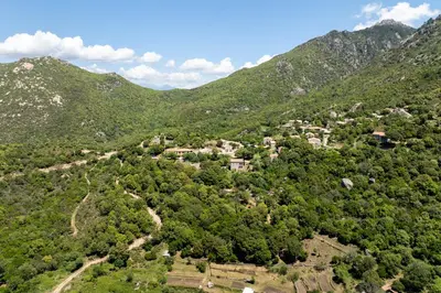 an aerial view of a village in the mountains at U Tadu - Maison de vacances en pierre avec vue et nature en Corse du Sud in Monacia-dʼAullène