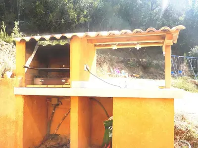 a bird house with a roof on top of it at Très joli gîte T3, 55m2 climatisé région Propriano 5 personnes in Compoli