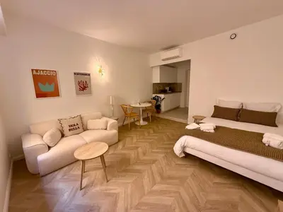 a living room with a couch and a table at Appartement Ajaccio Casa Dea in Ajaccio