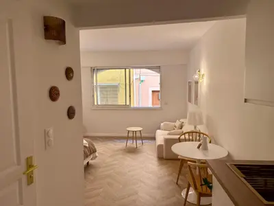 a living room with a couch and a table at Appartement Ajaccio Casa Dea in Ajaccio