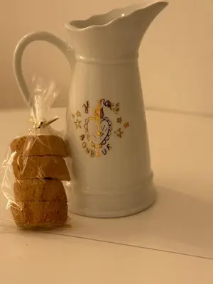 a white tea kettle and a piece of bread at Appartement Ajaccio Casa Dea in Ajaccio