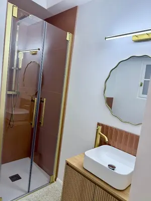 a bathroom with a sink and a shower at Appartement Ajaccio Casa Dea in Ajaccio