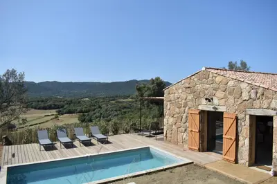 a villa with a swimming pool and a building at Amandula Bergerie Sotta hyper cozy in Sotta