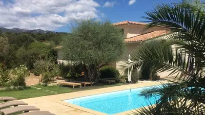 a swimming pool in front of a house at Villa ALETTI MJ piscine privée Porto Vecchio in Porto-Vecchio