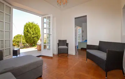 a living room with a couch and chairs at Appartement Calanches Piana in Piana
