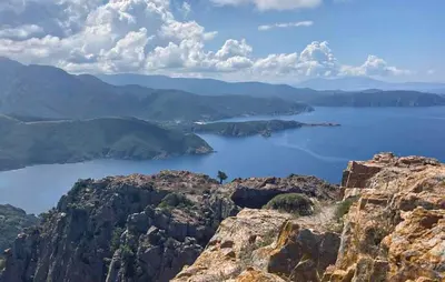 a view of a body of water from a mountain at Appartement Calanches Piana in Piana