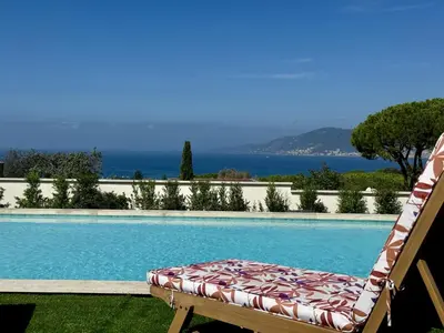 a house with a garden in front of it at Domaine LUMISTELLA 2 in Porticcio