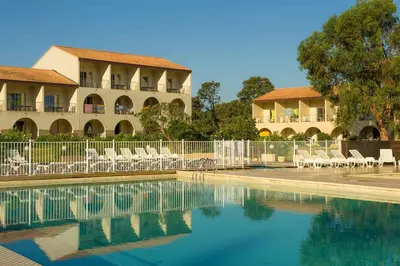 a swimming pool with chairs and a building at Beautiful accommodation, private residence in Linguizzetta