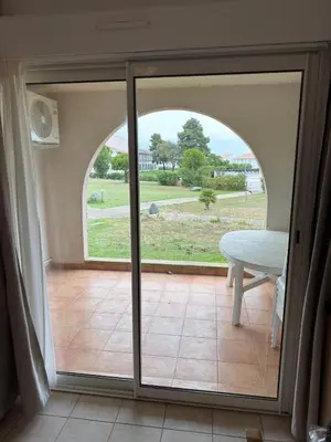 a sliding glass door with a view of a yard at Beautiful accommodation, private residence in Linguizzetta