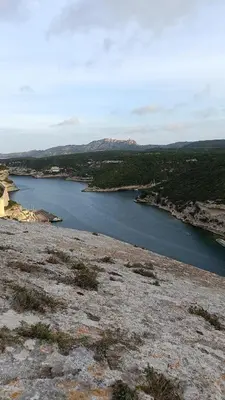a view of a body of water from a hill at Tana Torricella in Bonifacio
